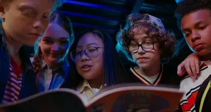 Horizontal video: A group of children looking at a book 4841989. Duration: 44 seconds. Resolution: 4096x2160