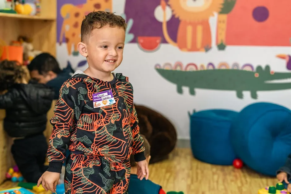 Happy child playing in vibrant preschool setting with colorful decorations.