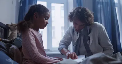 Horizontal video: Girl reading a book with a doctor 5867824. Duration: 30 seconds. Resolution: 4096x2160