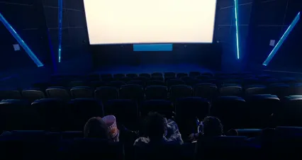 Horizontal video: Back view of friends watching a movie at the cinema 8262689. Duration: 25 seconds. Resolution: 4096x2160
