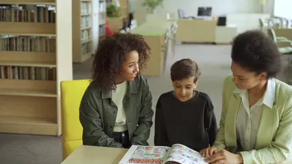 Horizontal video: A child and his parents reading together 8343387. Duration: 15 seconds. Resolution: 1920x1080