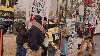 Horizontal video: People carrying placards at a rally 6581284. Duration: 36 seconds. Resolution: 3840x2160