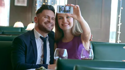 Horizontal video: An engaged couple taking a video of themselves using a smartphone 3209855. Duration: 18 seconds. Resolution: 3840x2160