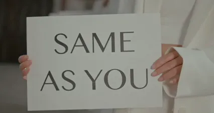 Horizontal video: Young people standing in line holding same as you slogan 10617617. Duration: 22 seconds. Resolution: 4096x2160