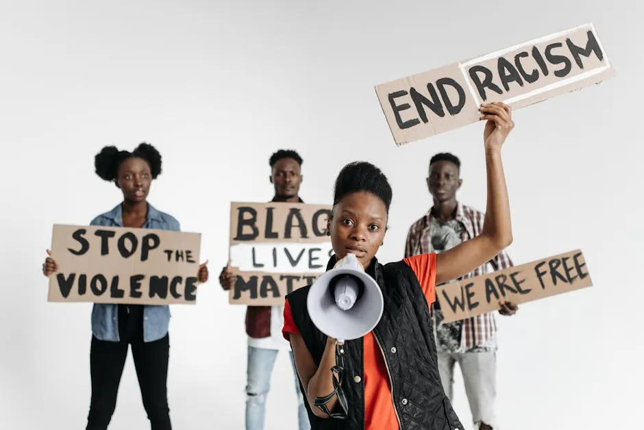Activists with Protest Signs and a Megaphone Protesting against Racism