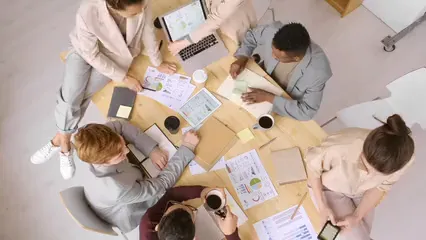 Horizontal video: A group of people discussing about charts and graphs in a business meeting 3250235. Duration: 10 seconds. Resolution: 3840x2160